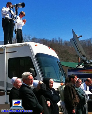 Photographing a Mennonite funeral while standing on top of an RV. (© 2010 Carmen K. Sisson/Apex MediaWire)