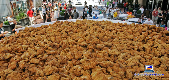 KFC marked the 70th anniversary of founder Colonel Harland Sanders' proprietary secret "Original Recipe" of 11 herbs and spices by attempting to set a new world record for largest single serving of fried chicken on Tuesday, Aug. 17, 2010 at Fourth Street Live! in Louisville, Ky. A KFC spokesman said more than 2,400 lbs. of chicken were served, shattering the as-yet uncertified previous record of 1,654 lbs. set by an Indiana festival in July. (Apex MediaWire Photo by Billy Suratt) (US NEWSPAPERS ONLY - ALL OTHER LICENSORS CONTACT ZUMAPRESS.COM)