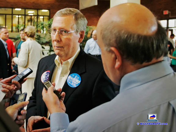 Senate Minority Leader Mitch McConnell (left) talks with Lexington Herald-Leader political writer Jack Brammer and other reporters during a 2010 Rand Paul campaign press gaggle in Murray, Ky. The 2014 race for McConnell's Senate seat is so important the Lexington Herald-Leader's hiring an additional political writer to help Brammer staff its Frankfort bureau. (Photo by Billy Suratt)