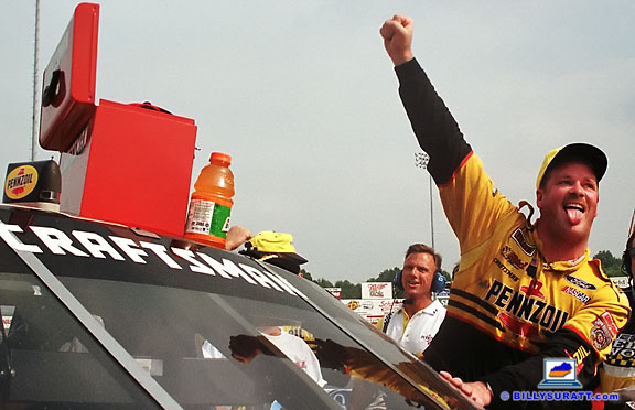 No. 19 Pennzoil Ford driver Tony Raines celebrates a Kroger 225 NASCAR Craftsman Truck Series win on Saturday, Aug. 29, 1998 at Louisville Speedway in Louisville, Ky. Capturing post-race celebrations in the winner's circle is an important part of race photography. (Photo by Billy Suratt)